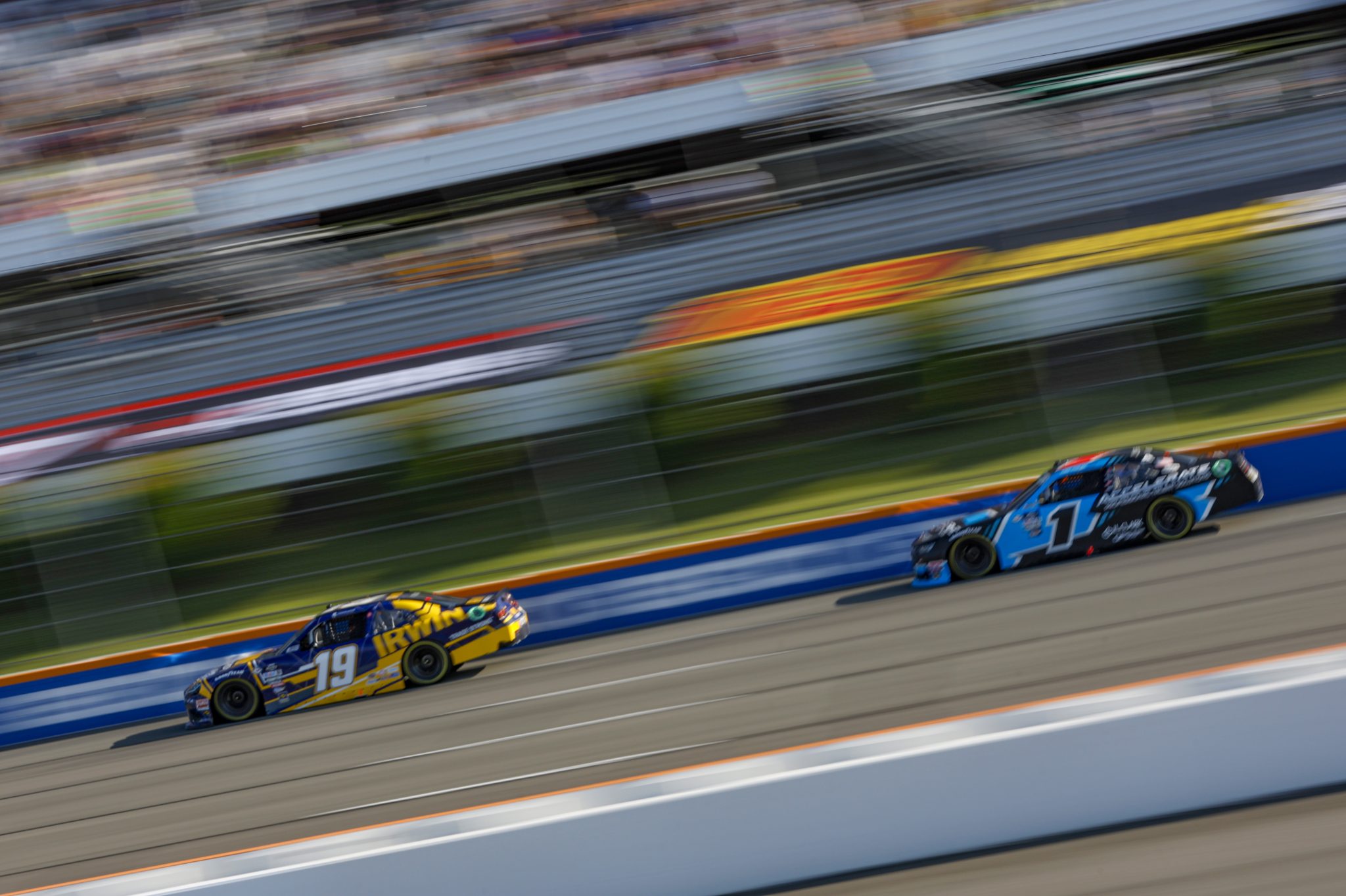 LONG POND, PENNSYLVANIA - JULY 22: Connor Mosack, driver of the #19 IRWIN TRADE STRONG Toyota, and Sam Mayer, driver of the #1 Accelerate Pros Talent Chevrolet, race during the NASCAR Xfinity Series Pocono 225 at Pocono Raceway on July 22, 2023 in Long Pond, Pennsylvania. (Photo by Sean Gardner/Getty Images) | Getty Images
