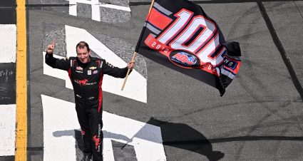 LONG POND, PENNSYLVANIA - JULY 22: Kyle Busch, driver of the #51 Zariz Transport Chevrolet, celebrates with a flag in celebration of Kyle Busch Motorsports' 100th win in the NASCAR Truck Series after winning the NASCAR Craftsman Truck Series CRC Brakleen 150 at Pocono Raceway on July 22, 2023 in Long Pond, Pennsylvania. (Photo by Logan Riely/Getty Images) | Getty Images
