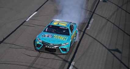 LONG POND, PENNSYLVANIA - JULY 23: Denny Hamlin, driver of the #11 Mavis Tires & Brakes Toyota, celebrates with a burnout after winning the NASCAR Cup Series HighPoint.com 400 at Pocono Raceway on July 23, 2023 in Long Pond, Pennsylvania. (Photo by Logan Riely/Getty Images) | Getty Images