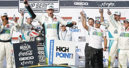 LONG POND, PENNSYLVANIA - JULY 23: Denny Hamlin, driver of the #11 Mavis Tires & Brakes Toyota, celebrates in victory lane after winning the NASCAR Cup Series HighPoint.com 400 at Pocono Raceway on July 23, 2023 in Long Pond, Pennsylvania. (Photo by Sean Gardner/Getty Images) | Getty Images
