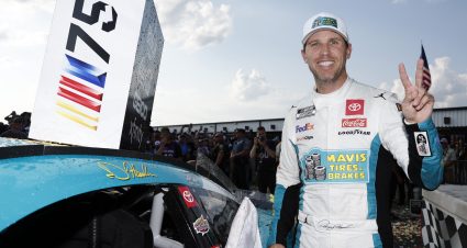 LONG POND, PENNSYLVANIA - JULY 23: Denny Hamlin, driver of the #11 Mavis Tires & Brakes Toyota, poses next to his winner sticker on his car in victory lane after winning the NASCAR Cup Series HighPoint.com 400 at Pocono Raceway on July 23, 2023 in Long Pond, Pennsylvania. (Photo by Sean Gardner/Getty Images) | Getty Images