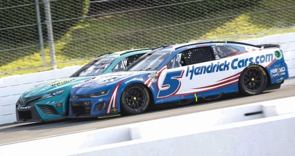 LONG POND, PENNSYLVANIA - JULY 23: Kyle Larson, driver of the #5 HendrickCars.com Chevrolet, and Denny Hamlin, driver of the #11 Mavis Tires & Brakes Toyota, make contact during the NASCAR Cup Series HighPoint.com 400 at Pocono Raceway on July 23, 2023 in Long Pond, Pennsylvania. (Photo by Sean Gardner/Getty Images) | Getty Images