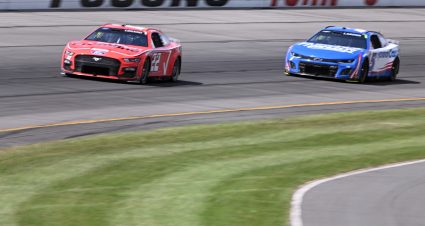 LONG POND, PENNSYLVANIA - JULY 23: Joey Logano, driver of the #22 Verizon Frontline Ford, and Kyle Larson, driver of the #5 HendrickCars.com Chevrolet, race during the NASCAR Cup Series HighPoint.com 400 at Pocono Raceway on July 23, 2023 in Long Pond, Pennsylvania. (Photo by Logan Riely/Getty Images) | Getty Images