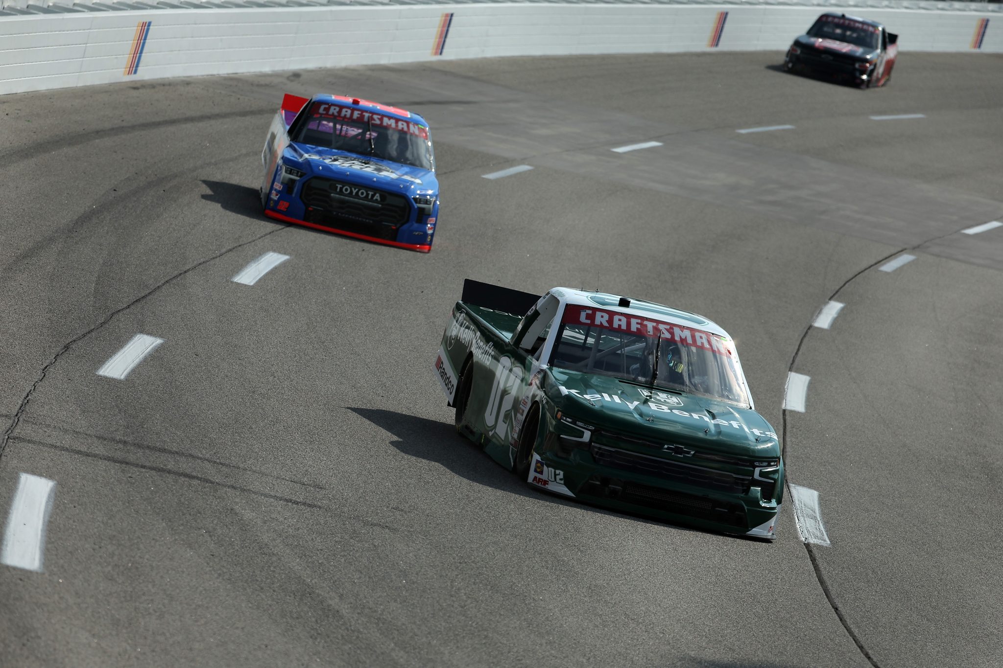 RICHMOND, VIRGINIA - JULY 28: Will Rodgers, driver of the #02 Kelly Benefits Chevrolet, and Stewart Friesen, driver of the #52 Halmar International Toyota, drive during practice for the NASCAR Craftsman Truck Series Worldwide Express 250 at Richmond Raceway on July 28, 2023 in Richmond, Virginia. (Photo by Jonathan Bachman/Getty Images) | Getty Images