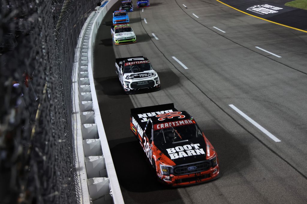 RICHMOND, VIRGINIA - JULY 29: Zane Smith, driver of the #38 Boot Barn Ford, Taylor Gray, driver of the #17 Dead On Tools Toyota, and Rajah Caruth, driver of the #24 Camp Cultivation Chevrolet, race during the NASCAR Craftsman Truck Series Worldwide Express 250 at Richmond Raceway on July 29, 2023 in Richmond, Virginia. (Photo by Jonathan Bachman/Getty Images) | Getty Images