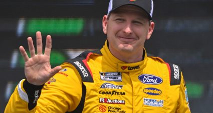 AUSTIN, TEXAS - MARCH 26: Michael McDowell, driver of the #34 Love's Travel Stops Ford, waves to fans as he walks onstage during driver intros prior to the NASCAR Cup Series EchoPark Automotive Grand Prix at Circuit of The Americas on March 26, 2023 in Austin, Texas. (Photo by Logan Riely/Getty Images) | Getty Images