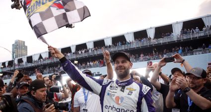 CHICAGO, ILLINOIS - JULY 02: Shane Van Gisbergen, driver of the #91 Enhance Health Chevrolet, celebrates with the checkered flag after winning the NASCAR Cup Series Grant Park 220 at the Chicago Street Course on July 02, 2023 in Chicago, Illinois. (Photo by Sean Gardner/Getty Images) | Getty Images