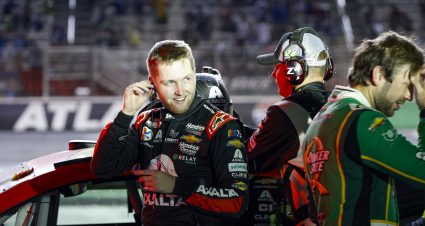 HAMPTON, GEORGIA - JULY 09: William Byron, driver of the #24 Axalta Chevrolet, (L) and Daniel Suarez, driver of the #99 Quaker State Chevrolet, react to the weather delay of the NASCAR Cup Series Quaker State 400 Available at Walmart at Atlanta Motor Speedway on July 09, 2023 in Hampton, Georgia. (Photo by Chris Graythen/Getty Images) | Getty Images