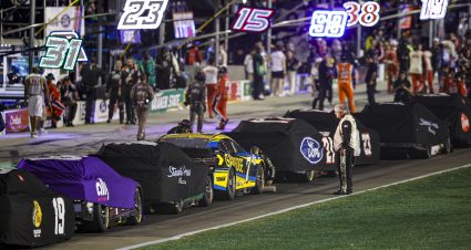 HAMPTON, GEORGIA - JULY 09: Car sit parked and covered after a weather-delay of the NASCAR Cup Series Quaker State 400 Available at Walmart at Atlanta Motor Speedway on July 09, 2023 in Hampton, Georgia. (Photo by Alex Slitz/Getty Images) | Getty Images