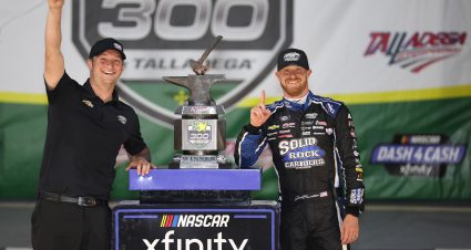 TALLADEGA, ALABAMA - APRIL 22: Jeb Burton, driver of the #27 Solid Rock Carriers Chevrolet, and team owner Jordan Anderson celebrate in victory lane after winning the NASCAR Xfinity Series Ag-Pro 300 at Talladega Superspeedway on April 22, 2023 in Talladega, Alabama. (Photo by James Gilbert/Getty Images) | Getty Images