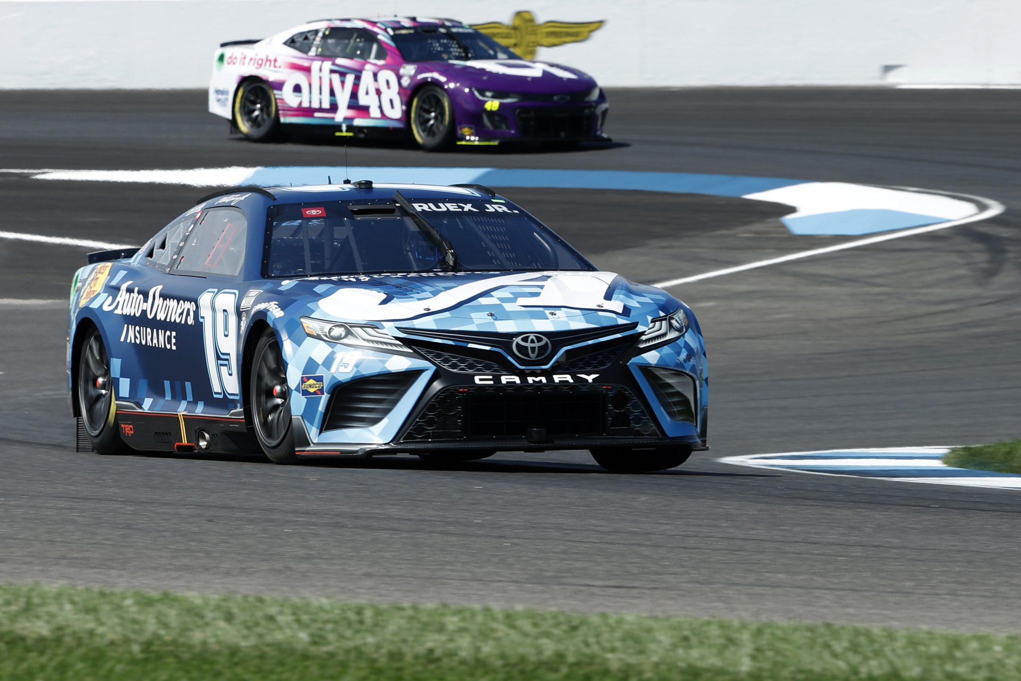 INDIANAPOLIS, INDIANA - AUGUST 12: Martin Truex Jr., driver of the #19 Auto-Owners Insurance Toyota, and Alex Bowman, driver of the #48 Ally Chevrolet, drive during practice for the NASCAR Cup Series Verizon 200 at the Brickyard at Indianapolis Motor Speedway on August 12, 2023 in Indianapolis, Indiana. (Photo by Justin Casterline/Getty Images) | Getty Images