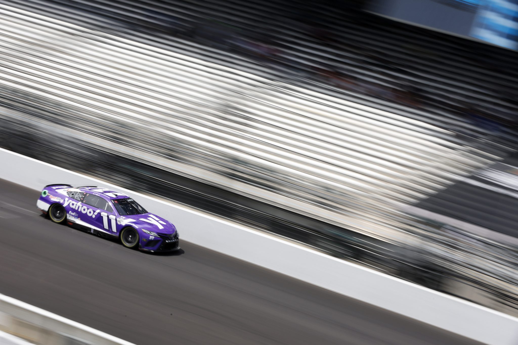 INDIANAPOLIS, INDIANA - AUGUST 12: Denny Hamlin, driver of the #11 Yahoo! Toyota, drives during qualifying for the NASCAR Cup Series Verizon 200 at the Brickyard at Indianapolis Motor Speedway on August 12, 2023 in Indianapolis, Indiana. (Photo by Sean Gardner/Getty Images) | Getty Images