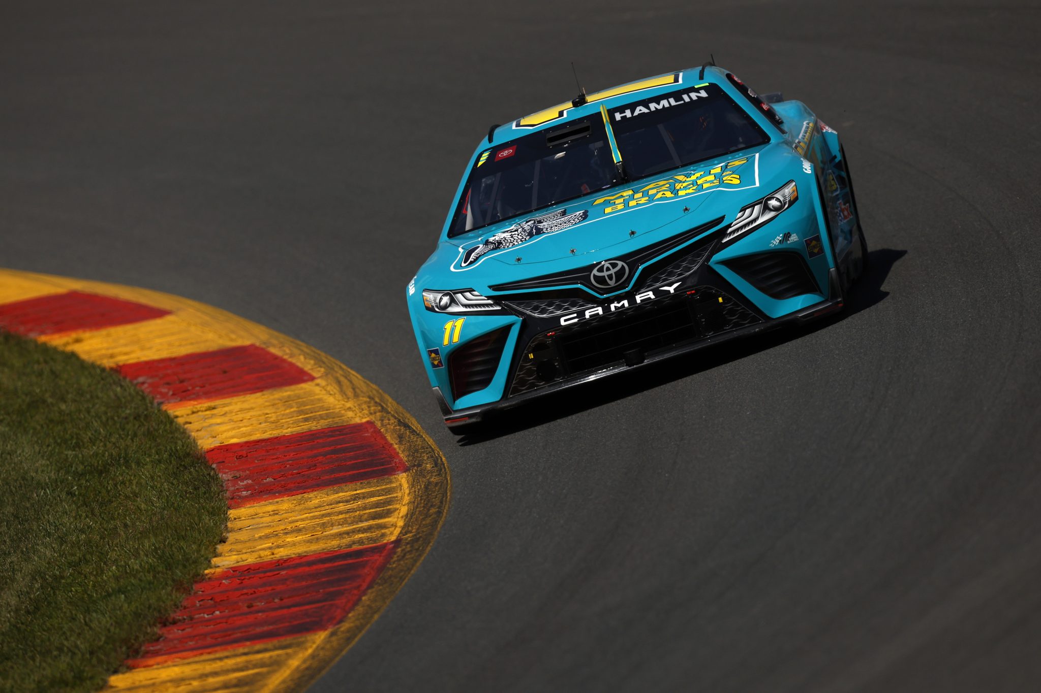 WATKINS GLEN, NEW YORK - AUGUST 19: Denny Hamlin, driver of the #11 Mavis Tires & Brakes Toyota, drives drives during practice for the NASCAR Cup Series Go Bowling at The Glen at Watkins Glen International on August 19, 2023 in Watkins Glen, New York. (Photo by Sean Gardner/Getty Images) | Getty Images