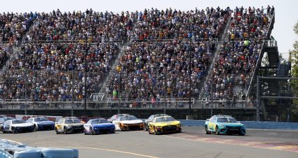 WATKINS GLEN, NEW YORK - AUGUST 20: Denny Hamlin, driver of the #11 Mavis Tires & Brakes Toyota, and Michael McDowell, driver of the #34 Love's Travel Stops Ford, lead the field to start the NASCAR Cup Series Go Bowling at The Glen at Watkins Glen International on August 20, 2023 in Watkins Glen, New York. (Photo by Chris Graythen/Getty Images) | Getty Images