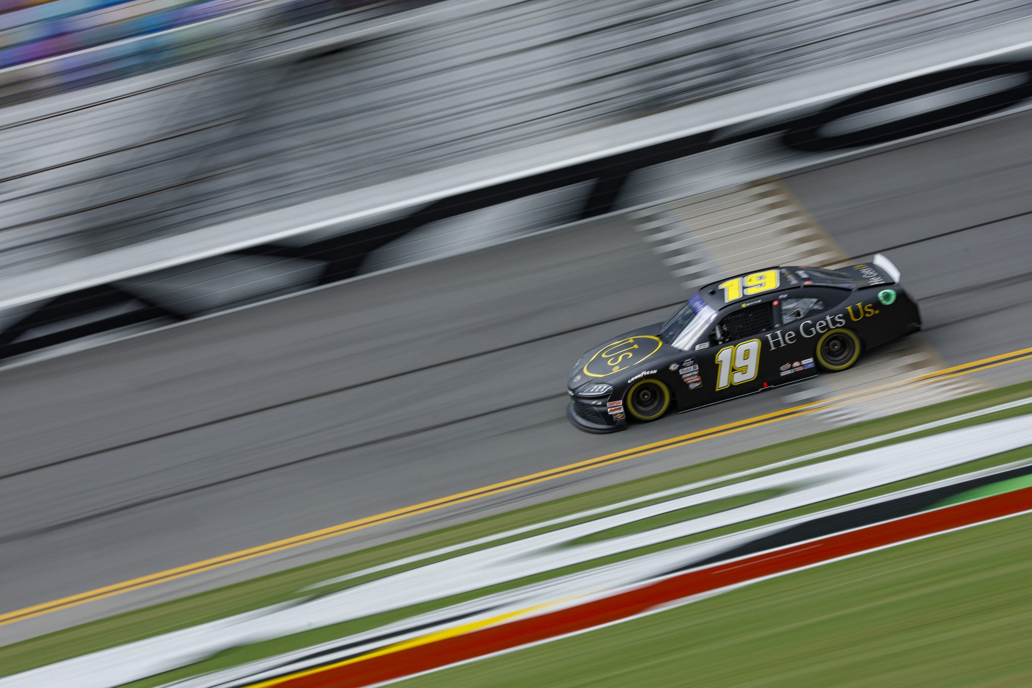 DAYTONA BEACH, FLORIDA - AUGUST 25: Trevor Bayne, driver of the #19 He Gets Us Toyota, drives during qualifying for the NASCAR Cup Series Coke Zero Sugar 400 at Daytona International Speedway on August 25, 2023 in Daytona Beach, Florida. (Photo by Sean Gardner/Getty Images) | Getty Images