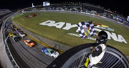 DAYTONA BEACH, FLORIDA - AUGUST 26: Chris Buescher, driver of the #17 Fifth Third Bank Ford, takes the checkered flag to win the NASCAR Cup Series Coke Zero Sugar 400 at Daytona International Speedway on August 26, 2023 in Daytona Beach, Florida. (Photo by James Gilbert/Getty Images) | Getty Images