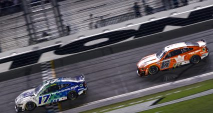 DAYTONA BEACH, FLORIDA - AUGUST 26: Chris Buescher, driver of the #17 Fifth Third Bank Ford, crosses the finish line ahead of Brad Keselowski, driver of the #6 King's Hawaiian Ford,  to win the NASCAR Cup Series Coke Zero Sugar 400 at Daytona International Speedway on August 26, 2023 in Daytona Beach, Florida. (Photo by Chris Graythen/Getty Images) | Getty Images
