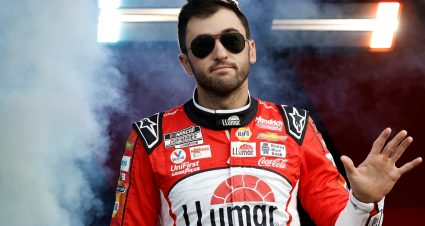 DAYTONA BEACH, FLORIDA - AUGUST 26: Chase Elliott, driver of the #9 LLumar Chevrolet, waves to fans as he walks onstage during driver intros prior to the NASCAR Cup Series Coke Zero Sugar 400 at Daytona International Speedway on August 26, 2023 in Daytona Beach, Florida. (Photo by James Gilbert/Getty Images) | Getty Images