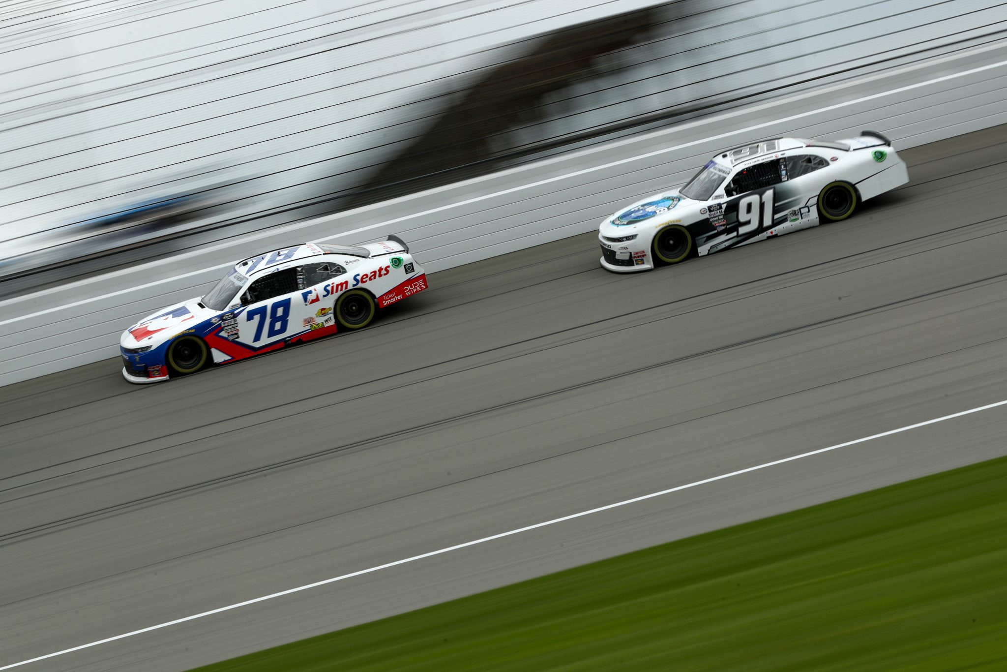 BROOKLYN, MICHIGAN - AUGUST 05: Anthony Alfredo, driver of the #78 Sim Seats Chevrolet, and Kyle Weatherman, driver of the #91 Fresh Water Chevrolet, race during the NASCAR Xfinity Series Cabo Wabo 250 at Michigan International Speedway on August 05, 2023 in Brooklyn, Michigan. (Photo by Meg Oliphant/Getty Images) | Getty Images