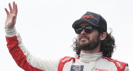 DOVER, DELAWARE - APRIL 29: Ryan Truex, driver of the #19 Toyota Genuine Accessories Toyota, waves to fans as he walks onstage during driver intros prior to the NASCAR Xfinity Series A-GAME 200 at Dover International Speedway on April 29, 2023 in Dover, Delaware. (Photo by James Gilbert/Getty Images) | Getty Images
