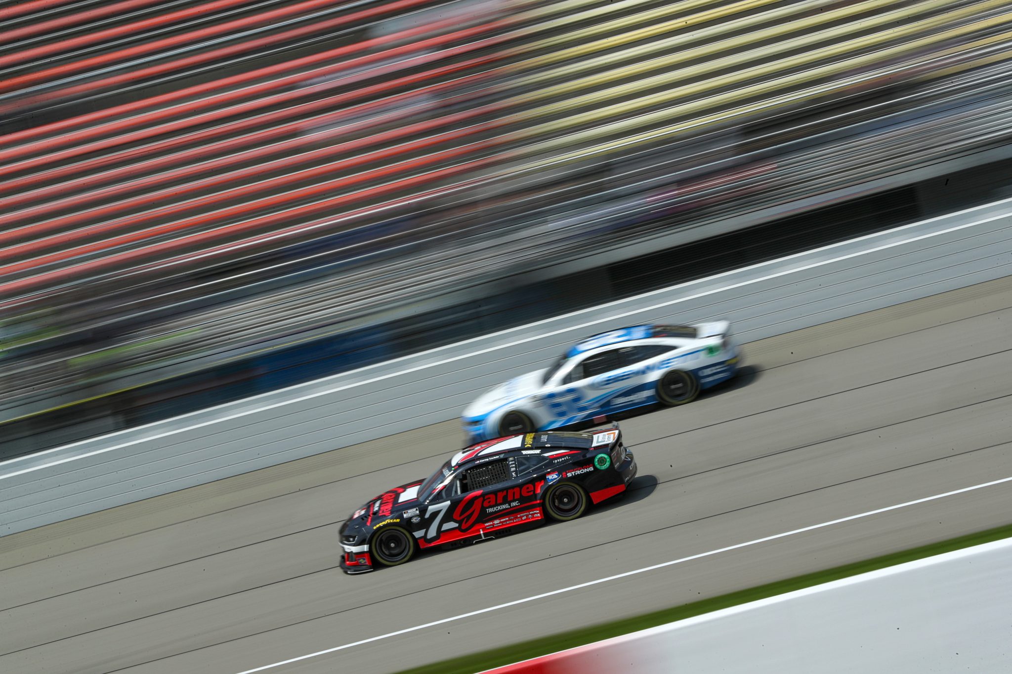 BROOKLYN, MICHIGAN - AUGUST 05: Corey LaJoie, driver of the #7 Garner Trucking Chevrolet, and Austin Hill, driver of the #62 Bennett Transportation/Beard Chevrolet, drive during practice for the NASCAR Cup Series FireKeepers Casino 400 at Michigan International Speedway on August 05, 2023 in Brooklyn, Michigan. (Photo by Meg Oliphant/Getty Images) | Getty Images