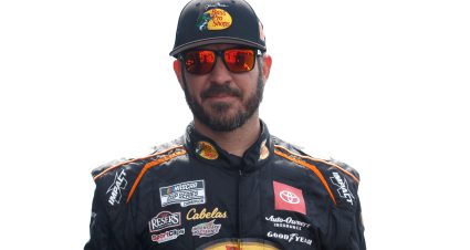 KANSAS CITY, KANSAS - SEPTEMBER 10: Martin Truex Jr., driver of the #19 Bass Pros Shops Toyota, walks onstage during driver intros prior to the NASCAR Cup Series Hollywood Casino 400 at Kansas Speedway on September 10, 2023 in Kansas City, Kansas. (Photo by Sean Gardner/Getty Images) | Getty Images