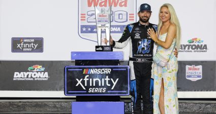 DAYTONA BEACH, FLORIDA - AUGUST 26: Jeremy Clements, driver of the #51 One Stop/ASE Chevrolet, and wife, Cortney Clements pose in victory lane after winning the NASCAR Xfinity Series Wawa 250 powered by Coca-Cola at Daytona International Speedway on August 26, 2022 in Daytona Beach, Florida. (Photo by James Gilbert/Getty Images) | Getty Images