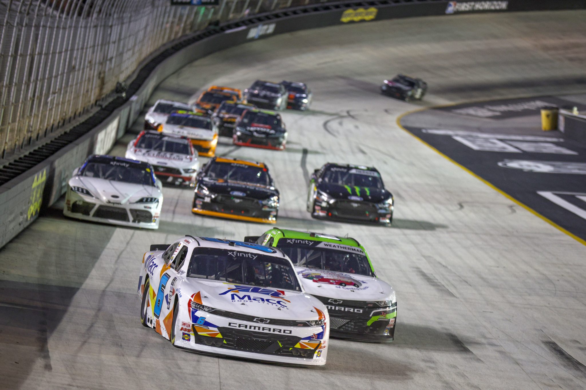 BRISTOL, TENNESSEE - SEPTEMBER 15: Brennan Poole, driver of the #6 Macc Door Systems Chevrolet, and Kyle Weatherman, driver of the #4 TeamJDMotorsports.com Chevrolet, race during the NASCAR Xfinity Series Food City 300 at Bristol Motor Speedway on September 15, 2023 in Bristol, Tennessee. (Photo by Jared C. Tilton/Getty Images) | Getty Images