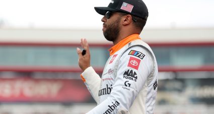 BRISTOL, TENNESSEE - SEPTEMBER 16: Bubba Wallace, driver of the #23 Columbia Sportswear Company Toyota, waves to fans as he walks onstage during driver intros prior to the NASCAR Cup Series Bass Pro Shops Night Race at Bristol Motor Speedway on September 16, 2023 in Bristol, Tennessee. (Photo by Jared C. Tilton/Getty Images) | Getty Images