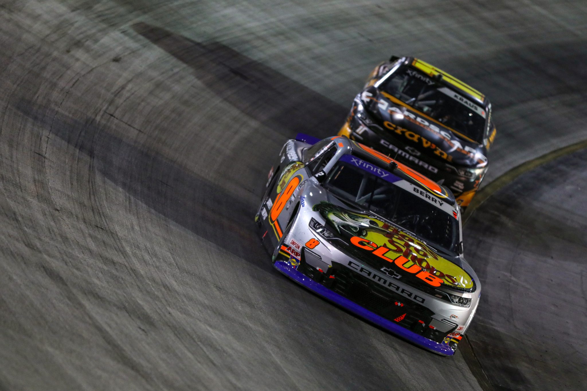 BRISTOL, TENNESSEE - SEPTEMBER 15: Josh Berry, driver of the #8 Bass Pro Shops/TRACKER Boats Chevrolet, and Derek Kraus, driver of the #11 Crav'n Flavor/Hardscape Construction Chevrolet, race during the NASCAR Xfinity Series Food City 300 at Bristol Motor Speedway on September 15, 2023 in Bristol, Tennessee. (Photo by Meg Oliphant/Getty Images) | Getty Images
