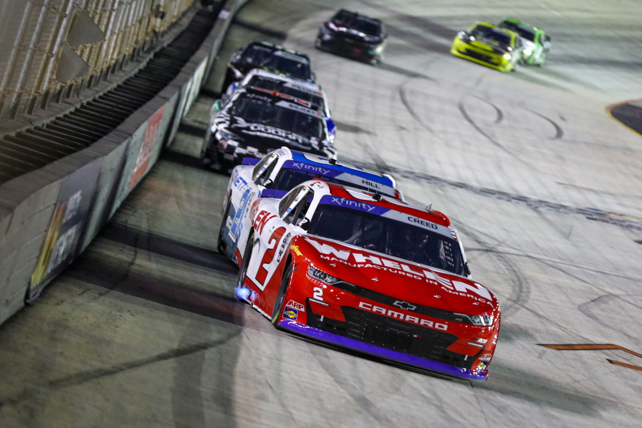 BRISTOL, TENNESSEE - SEPTEMBER 15: Sheldon Creed, driver of the #2 Whelen Chevrolet, and Austin Hill, driver of the #21 Bennett Transportation Chevrolet, race during the NASCAR Xfinity Series Food City 300 at Bristol Motor Speedway on September 15, 2023 in Bristol, Tennessee. (Photo by Meg Oliphant/Getty Images) | Getty Images