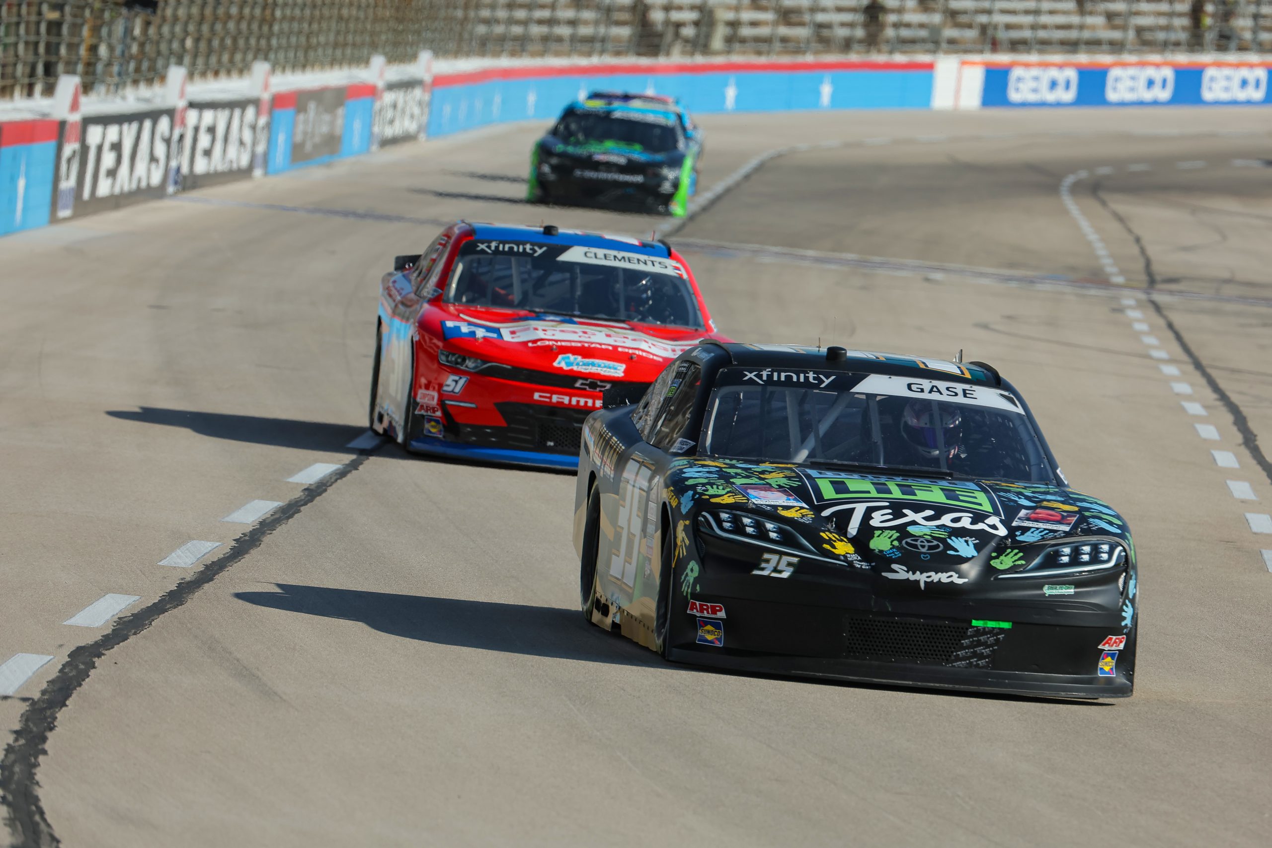 FORT WORTH, TEXAS - SEPTEMBER 23: Joey Gase, driver of the #35 Donate Life Texas Chevrolet, and Jeremy Clements, driver of the #51 First Pacific Funding Chevrolet, drive during practice for the NASCAR Xfinity Series Andy's Frozen Custard 300 - Practice at Texas Motor Speedway on September 23, 2023 in Fort Worth, Texas. (Photo by Jonathan Bachman/Getty Images) | Getty Images