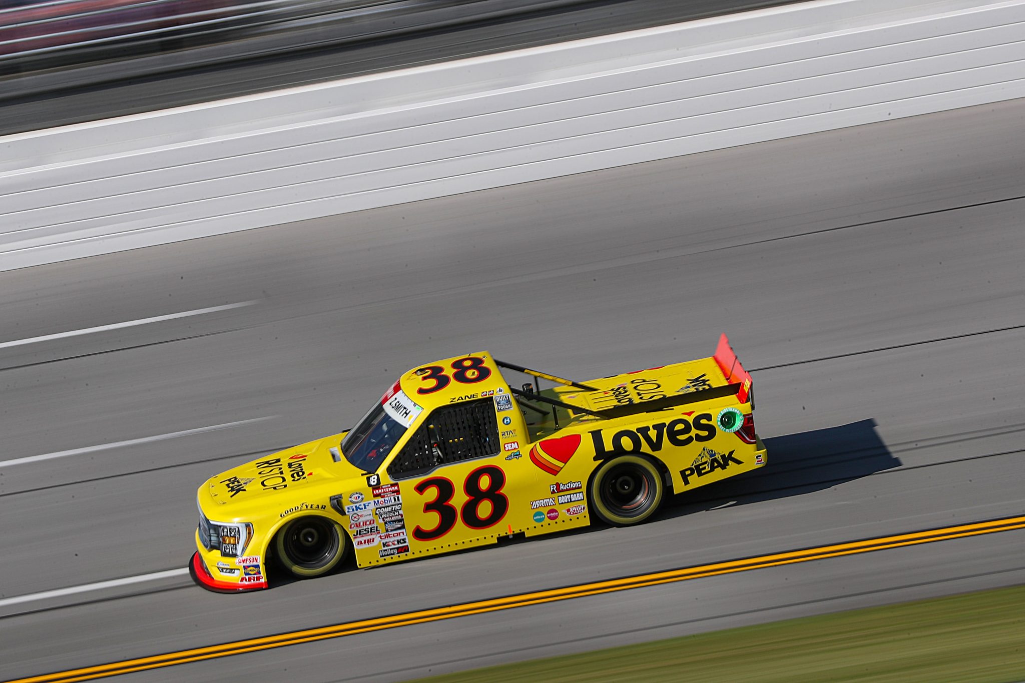 TALLADEGA, ALABAMA - SEPTEMBER 30: Zane Smith, driver of the #38 Love's/ RV Stop Ford, drives during qualifying for the NASCAR Craftsman Truck Series Love's RV Stop 250 at Talladega Superspeedway on September 30, 2023 in Talladega, Alabama. (Photo by Meg Oliphant/Getty Images) | Getty Images