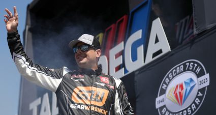 TALLADEGA, ALABAMA - SEPTEMBER 30: Stewart Friesen, driver of the #52 GearWrench Toyota, waves to fans as he walks onstage during driver intros prior to the NASCAR Craftsman Truck Series Love's RV Stop 250 at Talladega Superspeedway on September 30, 2023 in Talladega, Alabama. (Photo by Meg Oliphant/Getty Images) | Getty Images