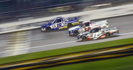 KANSAS CITY, KANSAS - SEPTEMBER 08: Christian Eckes, driver of the #19 PEAK/NAPA Nightvision Chevrolet, Zane Smith, driver of the #38 RTA rtatel.com Ford, and Corey Heim, driver of the #11 Safelite Toyota, race during the NASCAR Craftsman Truck Series Kansas Lottery 200 at Kansas Speedway on September 08, 2023 in Kansas City, Kansas. (Photo by Sean Gardner/Getty Images) | Getty Images