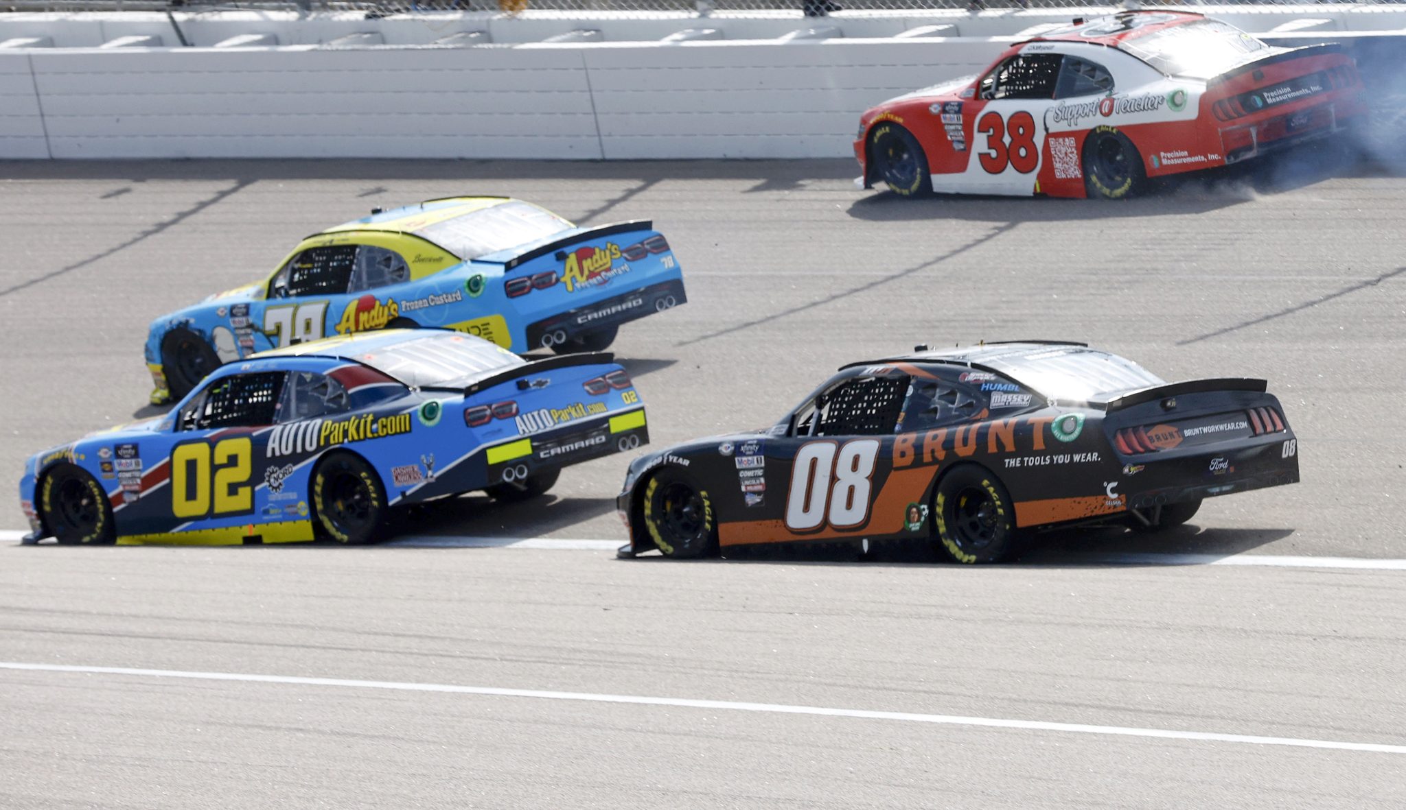 KANSAS CITY, KANSAS - SEPTEMBER 09: Nick Leitz, driver of the #38 Support a Teacher Ford, spins into the wall after an on-track incident as Mason Massey, driver of the #08 BRUNT Ford, Blaine Perkins, driver of the #02 AutoParkit.com Chevrolet, Anthony Alfredo, driver of the #78 Andy's Frozen Custard Chevrolet, pass during the NASCAR Xfinity Series Kansas Lottery 300 at Kansas Speedway on September 09, 2023 in Kansas City, Kansas. (Photo by Sean Gardner/Getty Images) | Getty Images