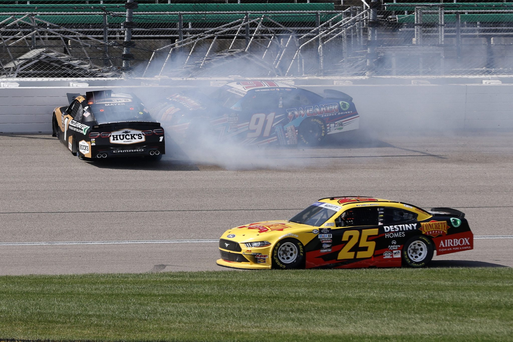 KANSAS CITY, KANSAS - SEPTEMBER 09: Kyle Weatherman, driver of the #91 Tweaker Energy Drinks Chevrolet, and Sam Mayer, driver of the #1 Huck's Market/Accelerate Chevrolet spin after an on-track incident as Brett Moffitt, driver of the #25 Concrete Supply/Destiny Homes Ford, avoids the incident during the NASCAR Xfinity Series Kansas Lottery 300 at Kansas Speedway on September 09, 2023 in Kansas City, Kansas. (Photo by Sean Gardner/Getty Images) | Getty Images