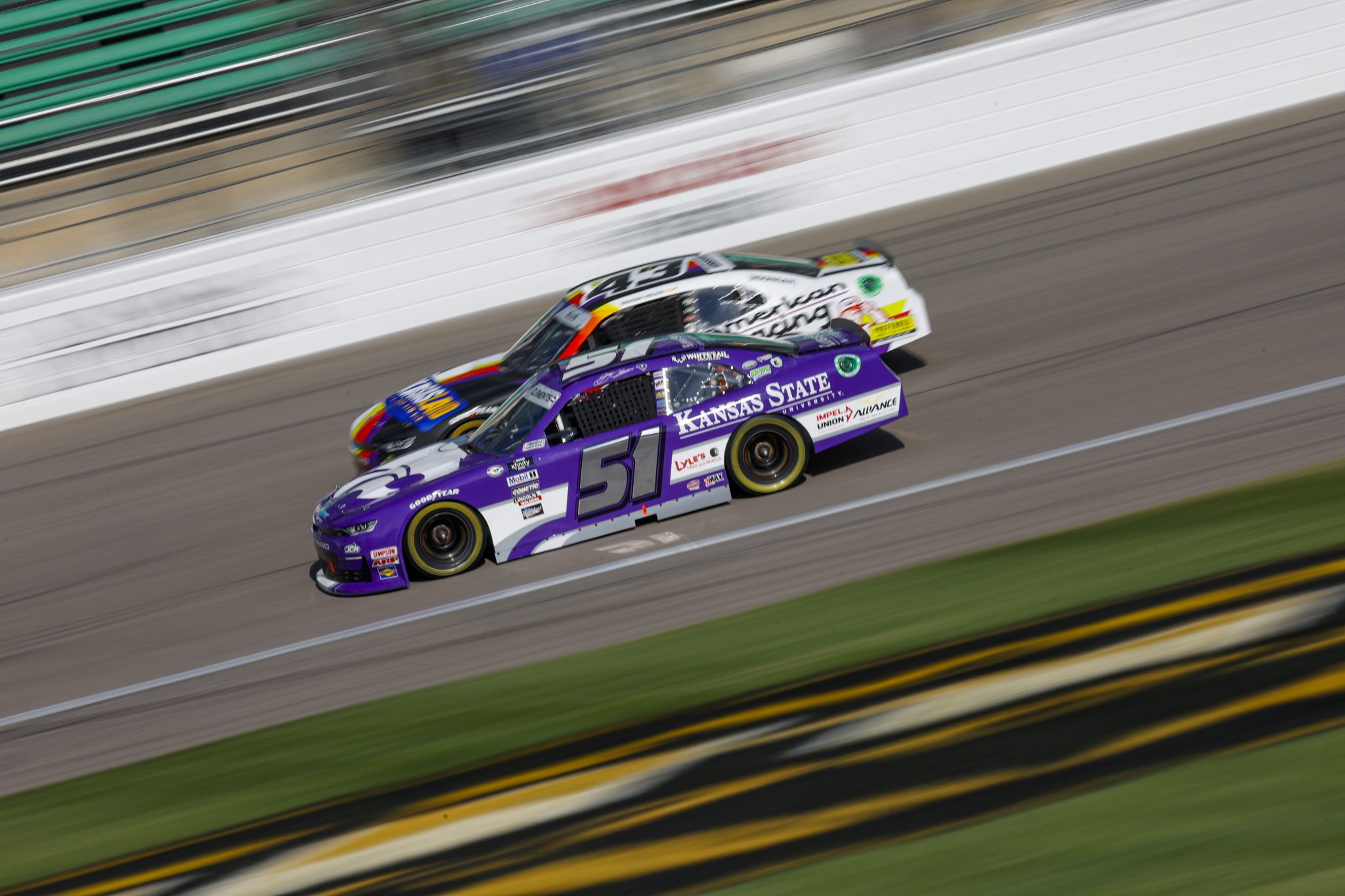 KANSAS CITY, KANSAS - SEPTEMBER 09: Jeremy Clements, driver of the #51 Kansas State University Chevrolet, and Ryan Ellis, driver of the #43 Kansas Land/American Racing Chevrolet, drive during practice for the NASCAR Xfinity Series Kansas Lottery 300 at Kansas Speedway on September 09, 2023 in Kansas City, Kansas. (Photo by Sean Gardner/Getty Images) | Getty Images