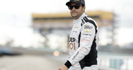 HOMESTEAD, FLORIDA - OCTOBER 20: Marco Andretti, driver of the #7 kin.com Chevrolet, walks the grid during practice for the NASCAR Craftsman Truck Series Baptist Health Cancer Care 200 at Homestead-Miami Speedway on October 20, 2023 in Homestead, Florida. (Photo by James Gilbert/Getty Images) | Getty Images
