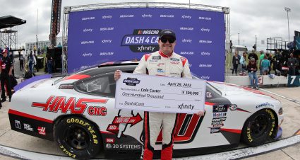 DOVER, DELAWARE - APRIL 29: Cole Custer, driver of the #00 Haas Automation Ford, poses with the $100,000 Xfinity Dash 4 Cash check after the NASCAR Xfinity Series A-GAME 200 at Dover International Speedway on April 29, 2023 in Dover, Delaware. (Photo by Tim Nwachukwu/Getty Images) | Getty Images