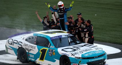 CONCORD, NORTH CAROLINA - OCTOBER 12: Sam Mayer, driver of the #1 QPS Employment Group Chevrolet, celebrates with his crew after winning the NASCAR Xfinity Drive for the Cure 250 presented by BCBS at Charlotte Motor Speedway on October 12, 2024 in Concord, North Carolina. (Photo by Jared C. Tilton/Getty Images) | Getty Images
