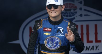 LEBANON, TENNESSEE - JUNE 28: Dawson Sutton, driver of the #26 Rackley Roofing Chevrolet, waves to fans as he walks onstage during driver intros prior to the NASCAR Craftsman Truck Series Rackley Roofing 200 at Nashville Superspeedway on June 28, 2024 in Lebanon, Tennessee. (Photo by Sean Gardner/Getty Images) | Getty Images