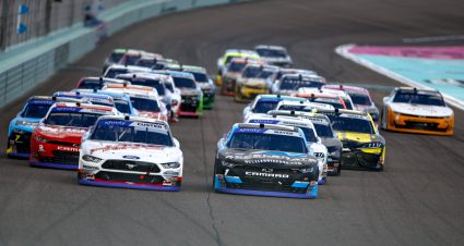 HOMESTEAD, FLORIDA - OCTOBER 21: Sam Mayer, driver of the #1 Accelerate Pros Talent Chevrolet, and Cole Custer, driver of the #00 Haas Automation Ford, race during the NASCAR Xfinity Series Contender Boats 300 at Homestead-Miami Speedway on October 21, 2023 in Homestead, Florida. (Photo by James Gilbert/Getty Images) | Getty Images