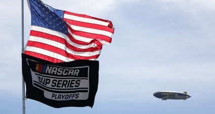 HOMESTEAD, FLORIDA - OCTOBER 27: A general view of the American and NASCAR Cup Series Playoffs flag and Goodyear blimp flying overhead prior to the NASCAR Cup Series Straight Talk Wireless 400 at Homestead-Miami Speedway on October 27, 2024 in Homestead, Florida. (Photo by James Gilbert/Getty Images) | Getty Images