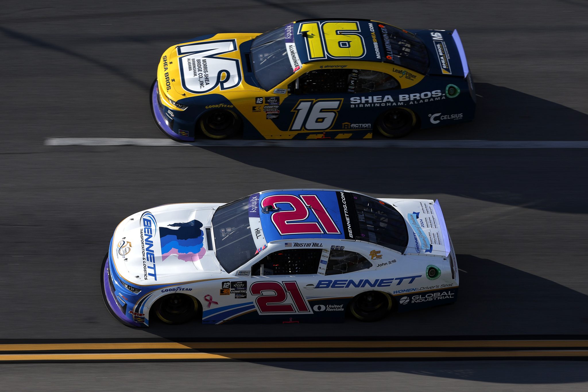 TALLADEGA, ALABAMA - OCTOBER 05: Austin Hill, driver of the #21 Bennett Transportation Chevrolet, and AJ Allmendinger, driver of the #16 Morris-Shea Bridge Co. Inc. Chevrolet, race during the NASCAR Xfinity Series United Rentals 250 at Talladega Superspeedway on October 05, 2024 in Talladega, Alabama. (Photo by Sean Gardner/Getty Images) | Getty Images