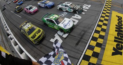 TALLADEGA, ALABAMA - OCTOBER 06: Ricky Stenhouse Jr., driver of the #47 Kroger Health/Palmolive Chevrolet, takes the checkered flag ahead of Brad Keselowski, driver of the #6 BuildSubmarines.com Ford, and William Byron, driver of the #24 RaptorTough.com Chevrolet, to win the NASCAR Cup Series YellaWood 500 at Talladega Superspeedway on October 06, 2024 in Talladega, Alabama. (Photo by Sean Gardner/Getty Images) | Getty Images