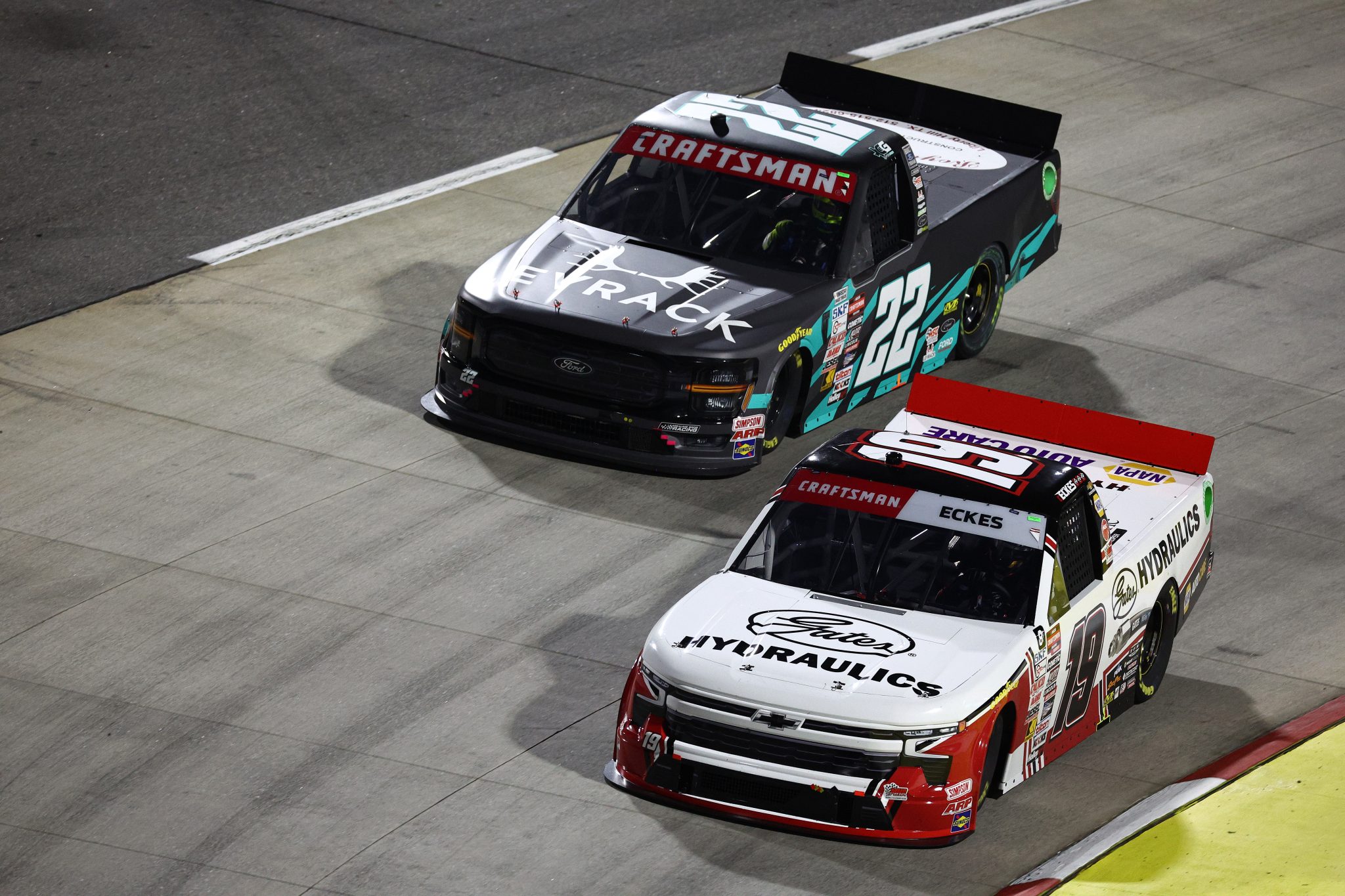 MARTINSVILLE, VIRGINIA - NOVEMBER 01: Christian Eckes, driver of the #19 Gates Hydraulics Chevrolet, and Clayton Green, driver of the #22 Royal Vista Inc Ford, race during the NASCAR Craftsman Truck Series Zip Buy Now, Pay Later 200 at Martinsville Speedway on November 01, 2024 in Martinsville, Virginia. (Photo by Jared C. Tilton/Getty Images) | Getty Images