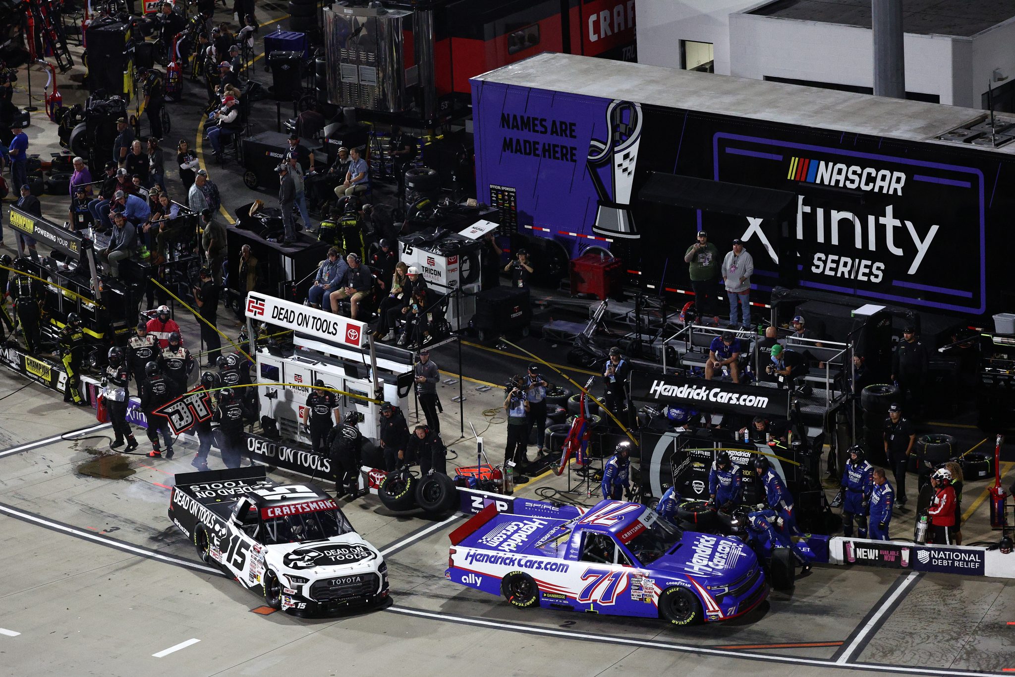 MARTINSVILLE, VIRGINIA - NOVEMBER 01: Rajah Caruth, driver of the #71 HendrickCars.com Chevrolet, and Tanner Gray, driver of the #15 Dead On Tools Toyota, pit during the NASCAR Craftsman Truck Series Zip Buy Now, Pay Later 200 at Martinsville Speedway on November 01, 2024 in Martinsville, Virginia. (Photo by Jared C. Tilton/Getty Images) | Getty Images