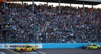AVONDALE, ARIZONA - NOVEMBER 10: Joey Logano, driver of the #22 Shell Pennzoil Ford, crosses the finish line ahead of Ryan Blaney, driver of the #12 Menards/RichmondWaterHeater Ford, to win the NASCAR Cup Series Championship Race at Phoenix Raceway on November 10, 2024 in Avondale, Arizona. (Photo by Jared C. Tilton/Getty Images) | Getty Images