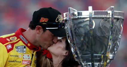 AVONDALE, ARIZONA - NOVEMBER 10: Joey Logano, driver of the #22 Shell Pennzoil Ford, and wife Brittany Logano kiss in victory lane after winning the NASCAR Cup Series Championship Race at Phoenix Raceway on November 10, 2024 in Avondale, Arizona. (Photo by James Gilbert/Getty Images) | Getty Images